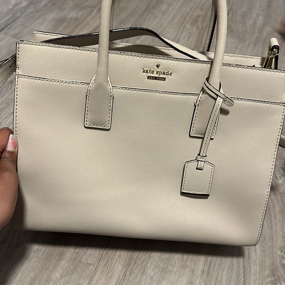 I am selling a Kate spade bag. Hasn’t been used that often. Fairly brand new. - Picture 2 of 4